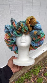 a mannequin wearing a crocheted hat